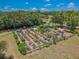 Aerial view of the community garden featuring raised garden beds and shaded seating area at 316 Lafayette Blvd, Oldsmar, FL 34677