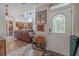 Inviting foyer featuring a decorative front door, tile flooring, and a glimpse into the open-concept living space at 316 Lafayette Blvd, Oldsmar, FL 34677