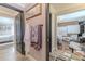 Hallway with dark doors leading to bedroom and office, natural light, and neutral paint at 316 Lafayette Blvd, Oldsmar, FL 34677