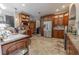 Well-equipped kitchen with stainless steel appliances, custom wood cabinetry, and granite countertops at 316 Lafayette Blvd, Oldsmar, FL 34677