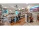 Bright studio space featuring hardwood floors, a large worktable, and ample lighting at 316 Lafayette Blvd, Oldsmar, FL 34677