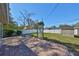 A backyard with a well-maintained lawn, privacy fence, and storage shed at 3226 20Th N St, St Petersburg, FL 33713