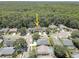 Charming single-Gathering home featuring well-maintained landscaping and a two-car garage in a lush green community at 3338 Laurelwood Ct, Tarpon Springs, FL 34688