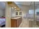 Bathroom features a double sink vanity with granite countertop, tile flooring, and a glass shower at 3338 Laurelwood Ct, Tarpon Springs, FL 34688