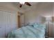 Comfortable bedroom with a plush bed, soft lighting and a ceiling fan for a cozy atmosphere at 3338 Laurelwood Ct, Tarpon Springs, FL 34688