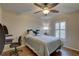 Bedroom has ceiling fan and an area for computer and desk, and shuttered window at 3338 Laurelwood Ct, Tarpon Springs, FL 34688