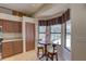 Cozy breakfast nook with bright windows and seating for two offers views of the outdoors at 3338 Laurelwood Ct, Tarpon Springs, FL 34688
