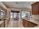 Bright kitchen with a breakfast nook featuring views of the screened pool area at 3338 Laurelwood Ct, Tarpon Springs, FL 34688