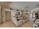 Comfortable living room with tile floors, neutral decor, and plenty of natural light at 3338 Laurelwood Ct, Tarpon Springs, FL 34688