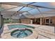 Beautiful screened pool area, with a spa and ample patio space for outdoor enjoyment at 3338 Laurelwood Ct, Tarpon Springs, FL 34688
