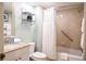 Bathroom featuring a tub/shower combo with white shower curtain and a granite countertop vanity at 36750 Us 19 N # 24-211, Palm Harbor, FL 34684