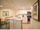 Modern kitchen with a breakfast bar and stainless steel appliances at 36750 Us 19 N # 24-211, Palm Harbor, FL 34684