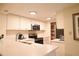 Well-lit kitchen equipped with modern appliances, countertop space, and ample storage at 36750 Us 19 N # 24-211, Palm Harbor, FL 34684