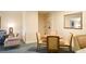 Living room area featuring a dining table and chairs for four people at 36750 Us 19 N # 24-211, Palm Harbor, FL 34684