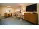 Spacious living room with a view to the kitchen and dining areas, and a flatscreen TV at 36750 Us 19 N # 24-211, Palm Harbor, FL 34684