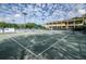 Well-maintained tennis courts with lush green surroundings and lighting for evening games at 36750 Us 19 N # 24-211, Palm Harbor, FL 34684
