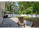 Backyard area showcases a patio, lounge chair, gazebo and white fencing at 3906 N Lynn Ave, Tampa, FL 33603