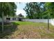 Spacious backyard offering a paved patio, gazebo, lush lawn, and full privacy fence at 3906 N Lynn Ave, Tampa, FL 33603