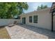 The backyard features patio, lounge chair and white fencing at 3906 N Lynn Ave, Tampa, FL 33603