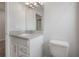 Clean bathroom boasts granite countertop vanity, white cabinets, and ample space at 3906 N Lynn Ave, Tampa, FL 33603
