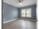 Bedroom featuring neutral paint, laminate floors, and bright window at 3906 N Lynn Ave, Tampa, FL 33603
