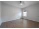Bedroom with laminate floors, ceiling fan, and natural light at 3906 N Lynn Ave, Tampa, FL 33603