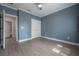 Bedroom with laminate floors, ceiling fan, and closet with double doors at 3906 N Lynn Ave, Tampa, FL 33603