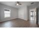 Bedroom with laminate floors, closet, ceiling fan, and natural light at 3906 N Lynn Ave, Tampa, FL 33603