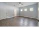 Spacious bedroom features modern ceiling fan, wood-look floors, and ensuite bathroom at 3906 N Lynn Ave, Tampa, FL 33603