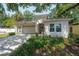 Charming single-story home featuring a well-manicured front yard and a two-car garage at 3906 N Lynn Ave, Tampa, FL 33603