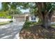Charming home with a well-manicured lawn, shade tree, and a two-car garage at 3906 N Lynn Ave, Tampa, FL 33603