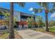 Exterior shot of Armature Works, featuring brick and metal architecture with trees at 3906 N Lynn Ave, Tampa, FL 33603
