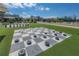 Outdoor area with giant checkers and chess on artificial turf and city views at 3906 N Lynn Ave, Tampa, FL 33603