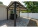 Backyard gazebo features a grill and white fencing at 3906 N Lynn Ave, Tampa, FL 33603