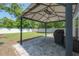 Backyard gazebo features a grill and white fencing at 3906 N Lynn Ave, Tampa, FL 33603