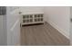 Hallway with stylish vinyl floors leading to a white cabinet at 3906 N Lynn Ave, Tampa, FL 33603