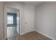 Hallway featuring laminate floors and white trim at 3906 N Lynn Ave, Tampa, FL 33603