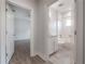 Hallway view into a bathroom with tiled floors and a bathtub at 3906 N Lynn Ave, Tampa, FL 33603