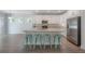 Spacious kitchen with an island, stainless appliances, white cabinets, granite countertops and breakfast bar seating at 3906 N Lynn Ave, Tampa, FL 33603