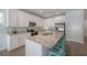 Beautiful kitchen with stainless appliances, granite countertops, and stylish barstool seating at 3906 N Lynn Ave, Tampa, FL 33603