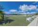 Spacious lawn with Adirondack chairs offering river and city views at 3906 N Lynn Ave, Tampa, FL 33603