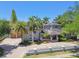 Aerial view of a large home with a circular driveway, mature trees, and well-maintained landscaping at 405 S Shore Crest Dr, Tampa, FL 33609