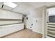 Finished basement with tiled floor, painted white cabinets, and countertop space at 405 S Shore Crest Dr, Tampa, FL 33609