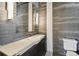 Modern bathroom featuring a unique vanity, sleek tiling, and contemporary lighting fixtures at 405 S Shore Crest Dr, Tampa, FL 33609