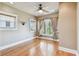 Bright bedroom with hardwood floors, neutral walls, and natural light from two large windows at 405 S Shore Crest Dr, Tampa, FL 33609