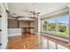 This living room features hardwood floors, a wet bar with wooden cabinetry, and water views from the windows at 405 S Shore Crest Dr, Tampa, FL 33609