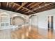 Open living area with wood floors, exposed beams, recessed lighting, and built-in shelving at 405 S Shore Crest Dr, Tampa, FL 33609