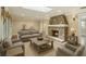 Inviting living room with a stone fireplace, a skylight, neutral colors, and comfortable seating at 405 S Shore Crest Dr, Tampa, FL 33609