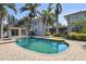 Private pool area with palm trees, a cabana, and brick paved deck at 405 S Shore Crest Dr, Tampa, FL 33609