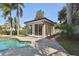 Poolside cabana, featuring large glass windows, ideal for relaxing or entertaining at 405 S Shore Crest Dr, Tampa, FL 33609